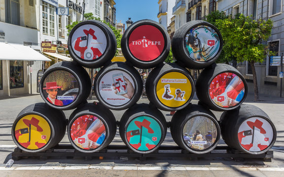 JEREZ DE LA FRONTERA, SPAIN - MAY 15, 2019: Colorful barrels in the streets of Jerez de la Frontera, Spain