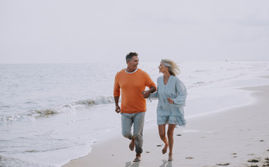 Happy senior couple spending time at the beach. Concepts about love,seniority and people