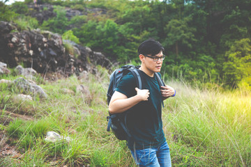 Man backpacker hiking in mountains alone outdoor. adventure active summer vacations outdoor rocky mountains on background