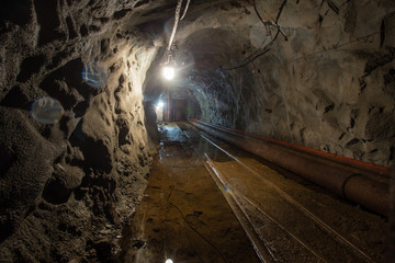 Gold mine ore shaft tunnel with rails