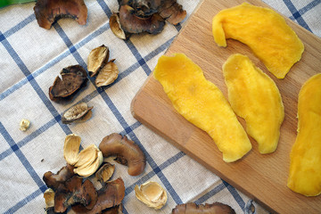 Dehydrated Mango or Dried Mango slices on wooden table   