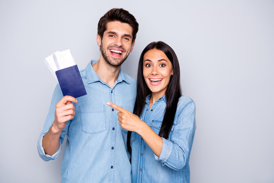 Photo of funny guy and lady holding plane tickets and passports going to engage abroad wear casual outfits isolated grey color background