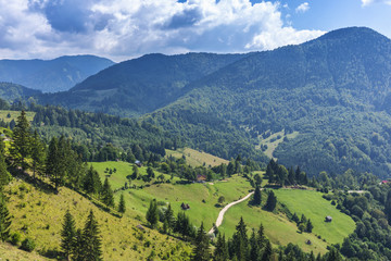Fototapeta na wymiar Stunning alpine landscape and green fields, Transylvania, Romania, Europe