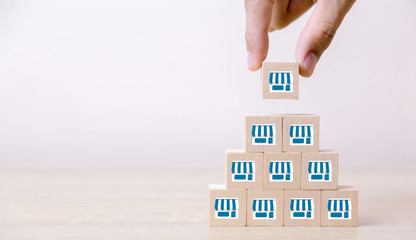 Franchise business concep,hand choose wood blog with franchise marketing.