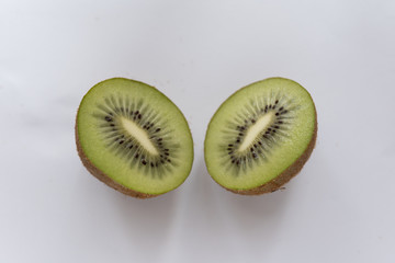 sliced ​​kiwi fruit on a white background
