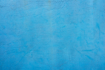 Blue painted on wall texture. The old wall with beautiful colors is a space for pictures or text.