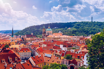 Obraz premium Top view to red roofs skyline of Prague city, Czech Republic. Aerial view of Prague city with terracotta roof tiles, Prague, Czechia. Old Town architecture with terracotta roofs in Prague.