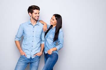 Portrait of his he her she nice-looking attractive charming cute lovely cheerful cheery glad couple wearing casual standing together flirting isolated on light white gray pastel color background