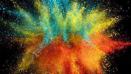 Explosion of colored powder on black background