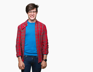 Fototapeta premium Young handsome student man wearing glasses over isolated background with a happy and cool smile on face. Lucky person.