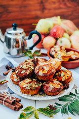 Healthy fall vegetarian dessert. Apple cupcake with pumpkin, almond seeds and spices.