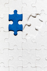Jigsaw puzzle with missing piece. Missing puzzle pieces. Concept image of unfinished task. Completing final task, missing jigsaw puzzle pieces and business concept with a puzzle piece missing.
