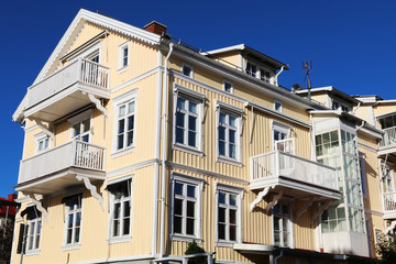 Fototapeta na wymiar Yellow painted wooden building, Strömstad, Sweden