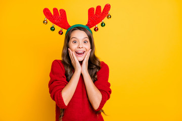 Portrait of excited shocked brunette curly hair beautiful child get present cristmas newyear party...