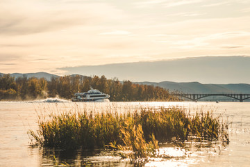 passenger boat on the river at sunset