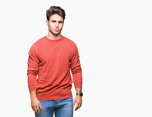 Fototapeta premium Young handsome man over isolated background skeptic and nervous, frowning upset because of problem. Negative person.