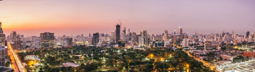 Fototapeta na wymiar Panorama of Bangkok City skyline with urban skyscrapers at sunset