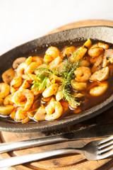 Shrimp in casserole on white background