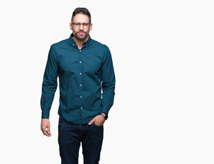 Young handsome business man wearing glasses over isolated background skeptic and nervous, frowning upset because of problem. Negative person.