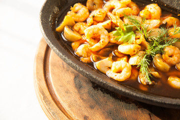 Shrimp in casserole on white background