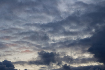 The sky at sunset with black rain clouds