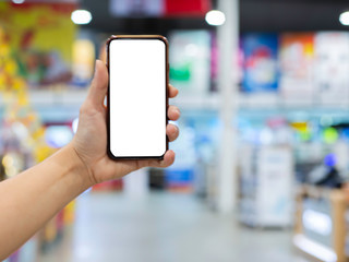 hands holding smart phone with blank screen