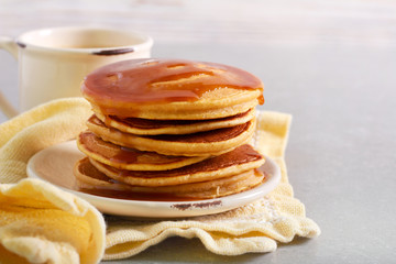 Pumpkin pancake stack with caramel sauce