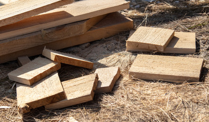 The boards are on the ground at a construction site