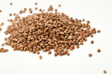 handful of buckwheat on a white table