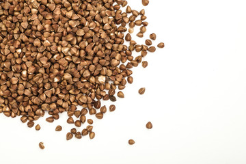 handful of buckwheat on a white table frame