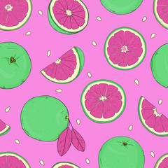 Green oranges, pieces and whole on a pink background.