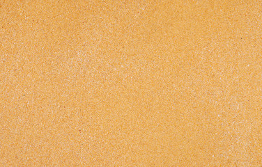 Sand surface and background. Sand Texture. Brown sand. Background from fine sand. Sand background. Closeup of sand pattern of a beach in the summer.