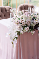 Luxury decoration of the modern wedding table flowers in light shades.