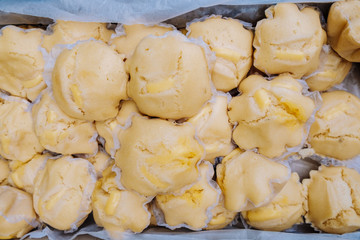 Closeup of freshly made fluffy, soft, and delicious Cheese Puto or Filipino Steamed Cake in a box. Selective focus. 