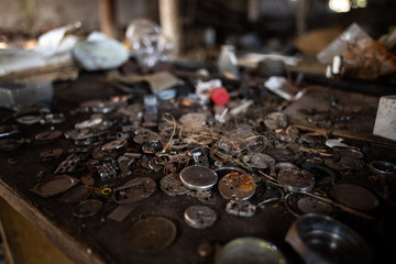 Old watch mechanisms / parts on table