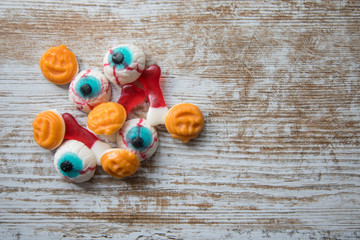 Halloween sweets on wooden surface