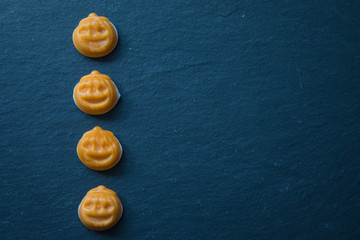 Halloween pumpkins  on black surface
