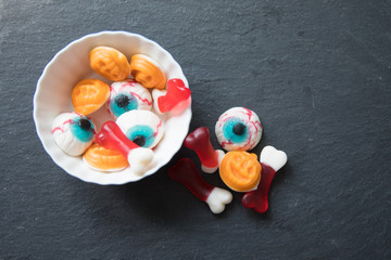 Halloween candies  on black surface