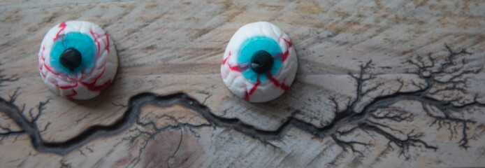 Halloween eyes on a wooden surface