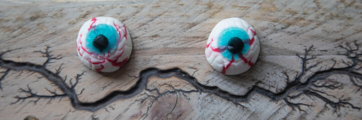 Halloween eyes on a wooden surface