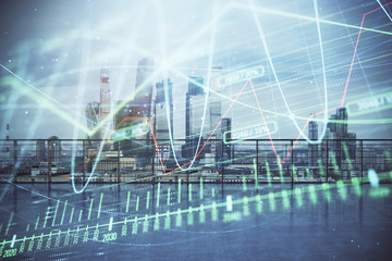 Forex graph hologram with city view from roof background. Double exposure. Stock market concept.