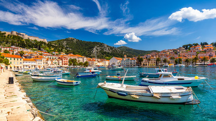 View at amazing archipelago with fishing boats in town Hvar, Croatia. Harbor of old Adriatic island town Hvar. Popular touristic destination of Croatia. Amazing Hvar city on Hvar island, Croatia.