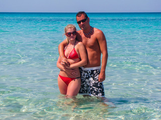 Beautiful young couple in holiday on the beach