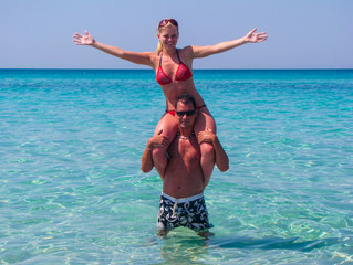 Beautiful young couple in holiday on the beach