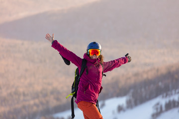 charming girl in stylish clothes with raised arms looking at the camera, awesome sportswoman...