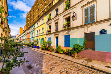 Cremieux Street (Rue Cremieux), Paris, France. Rue Cremieux in the 12th Arrondissement is one of the prettiest residential streets in Paris. Colored houses in Rue Cremieux street in Paris. France.