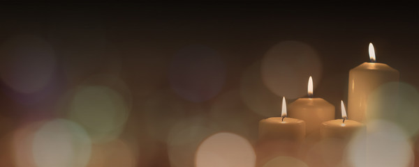 Christmas advent candle light in church with blurry golden bokeh for religious ritual or spiritual zen meditation, peaceful mind and soul, or funeral ceremony - obrazy, fototapety, plakaty