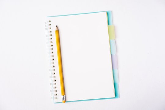 Blank notebook on white table, copy space for text