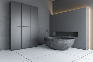 Gray loft bathroom with tub and closet