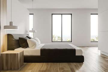 Side view of minimalistic white master bedroom